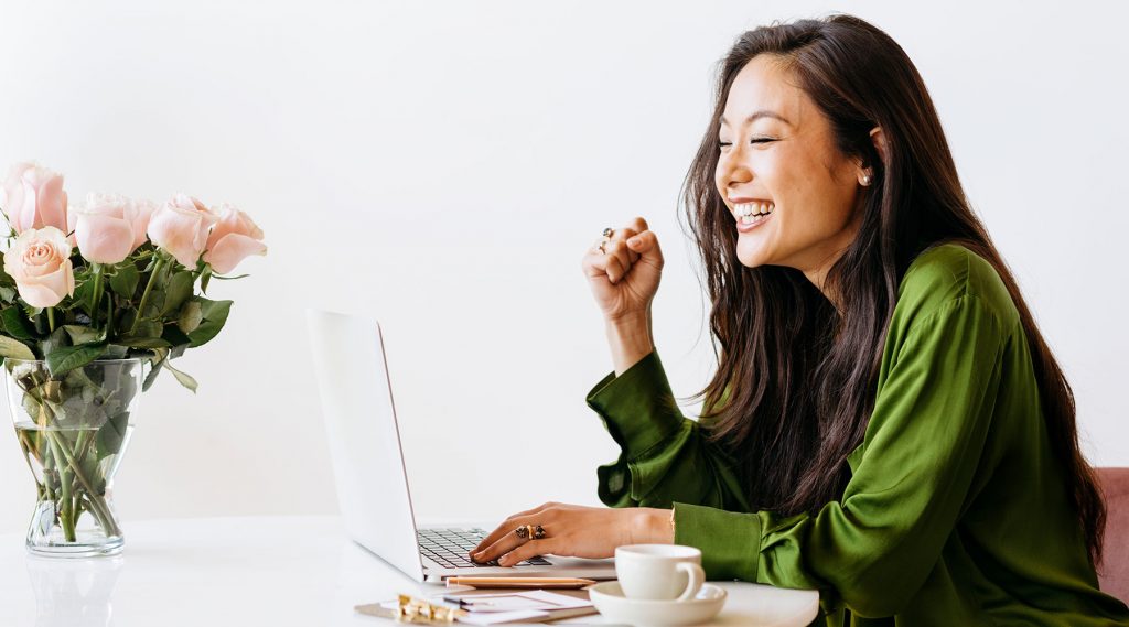 Smiling asian woman working