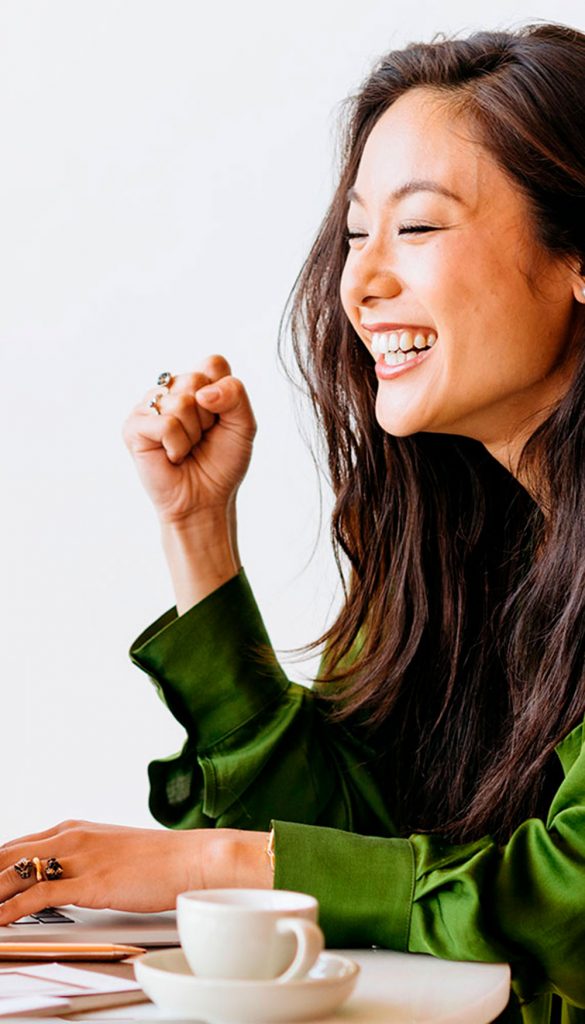 Smiling asian woman working