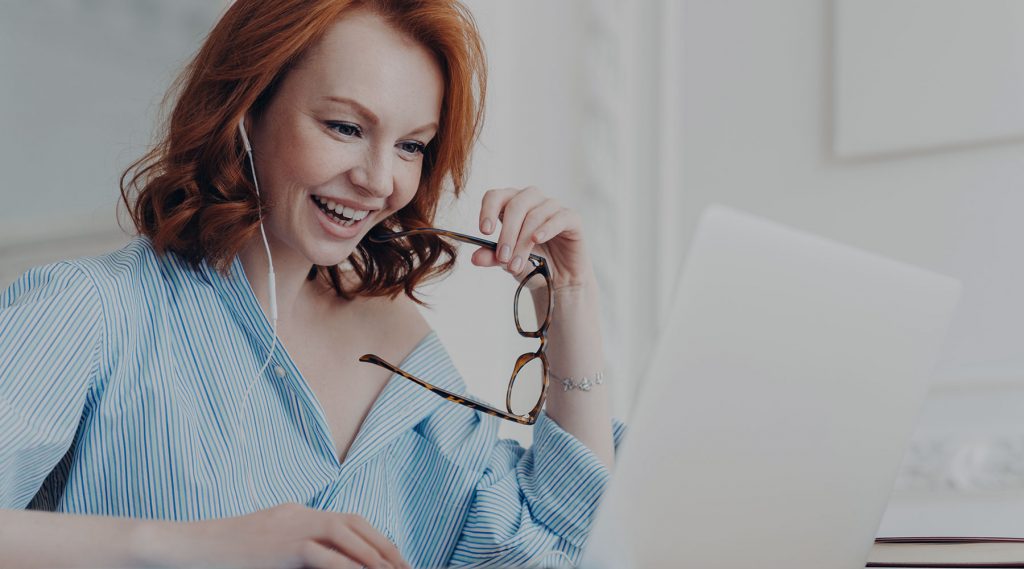 Happy woman working on laptop