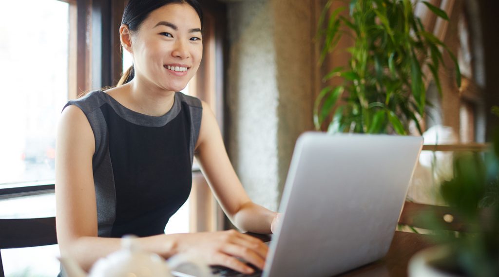 Asian woman working on laptop